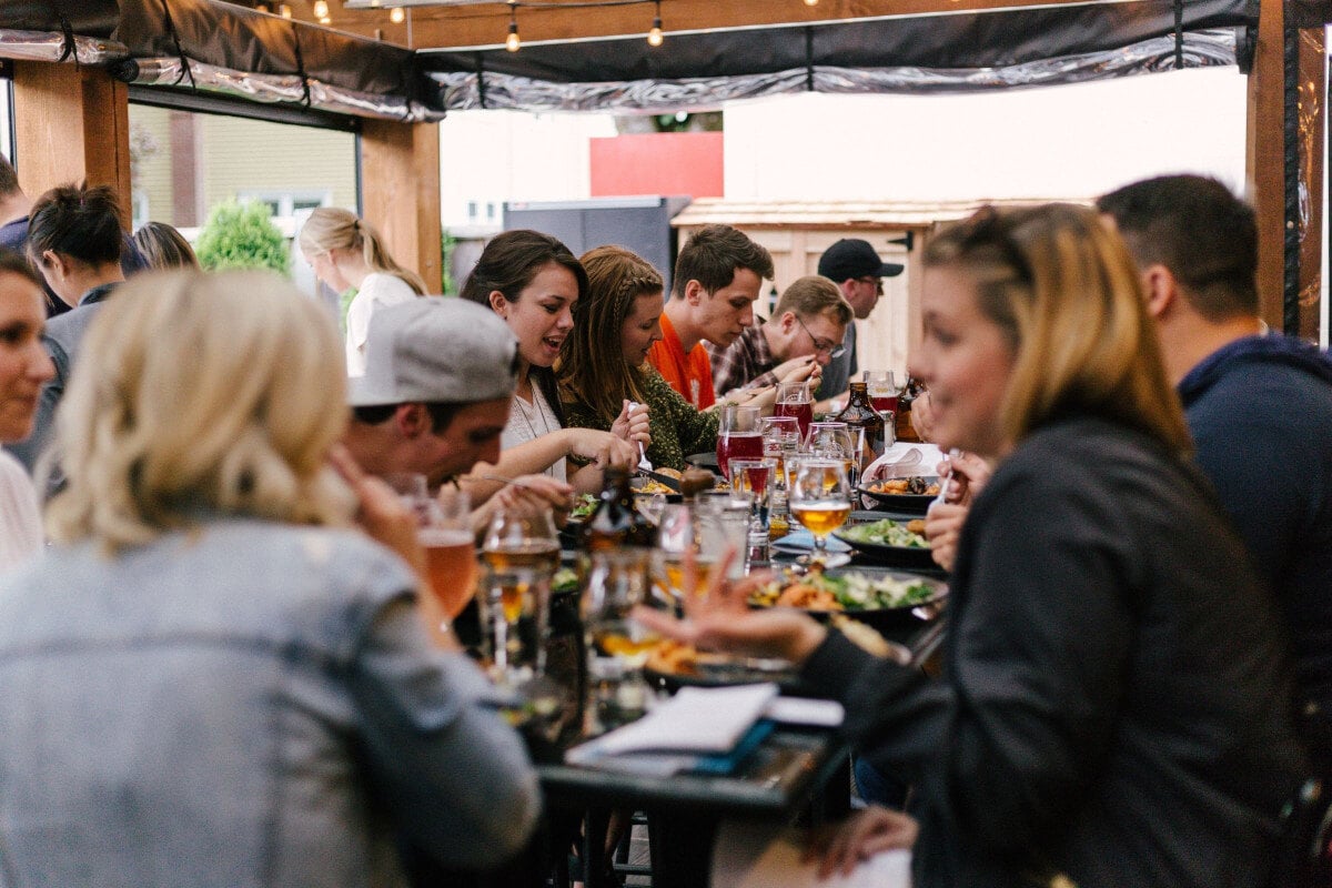 customers at a restaurant using guest engagement software