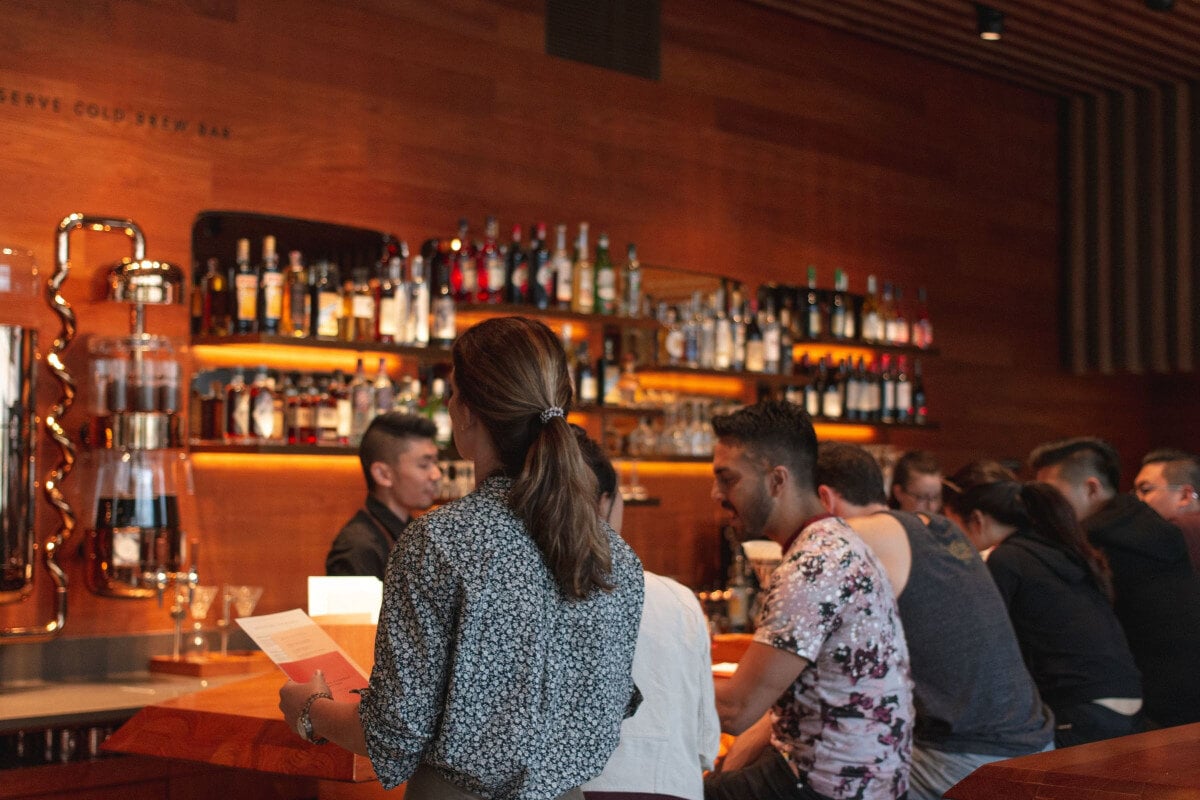 loyal restaurant customers sitting at a bar