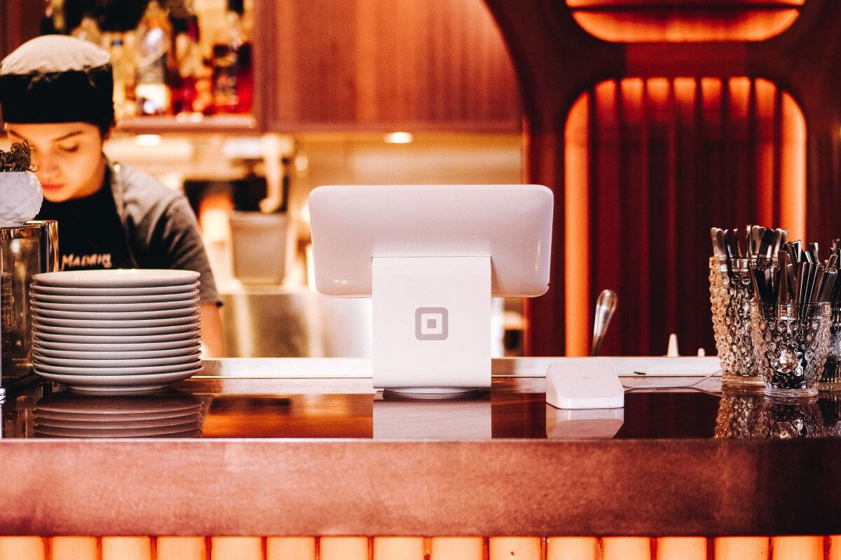 restaurant front desk with staff